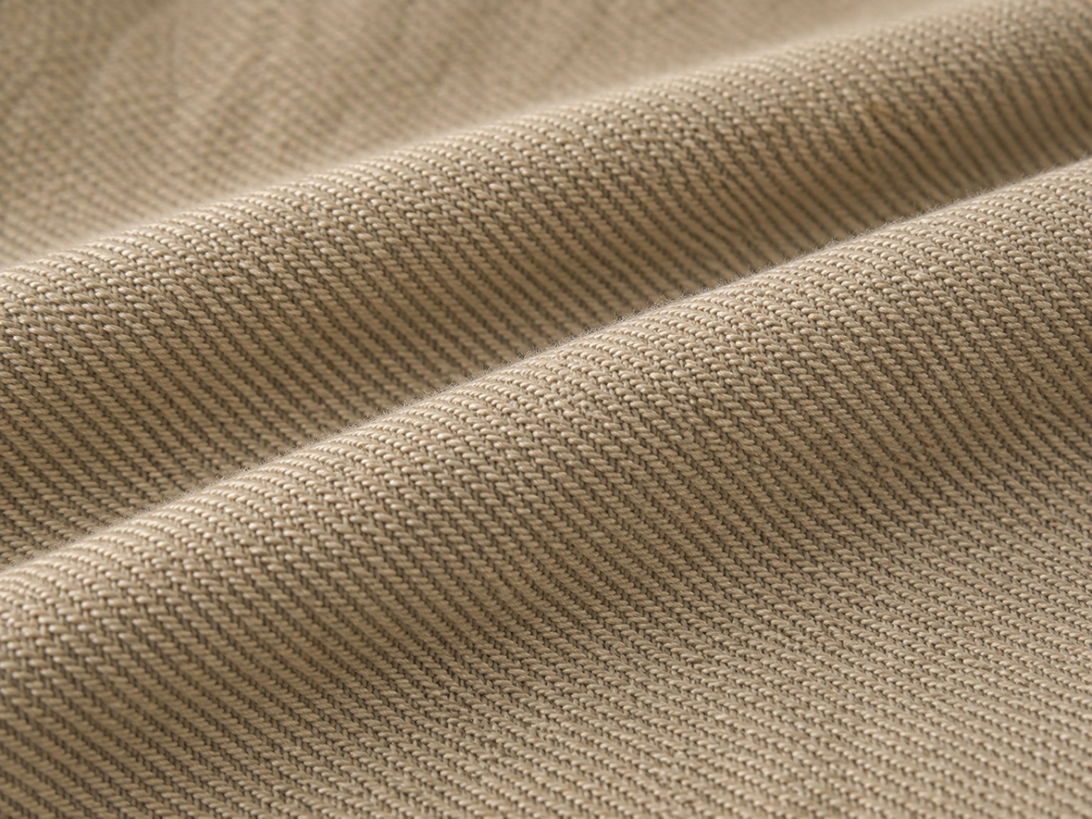 Macrofotografia de tecido plano em sarja com diagonal formada pelo entrelaçamento dos fios